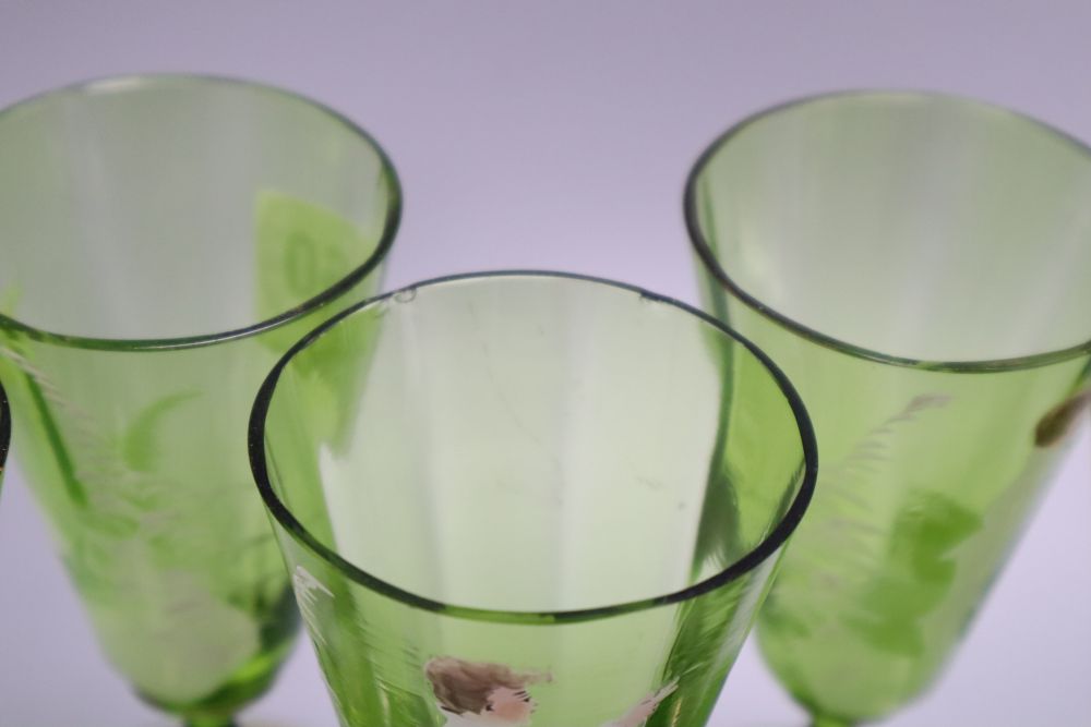 A Victorian Mary Gregory decorated green glass decanter, height 33cm and six tumblers